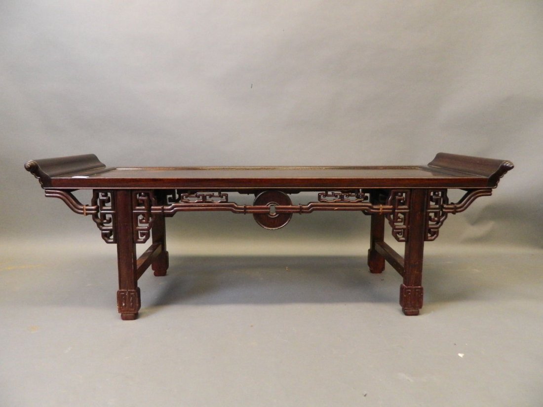 A Chinese hardwood low table with carved and pierced (1 of 2)