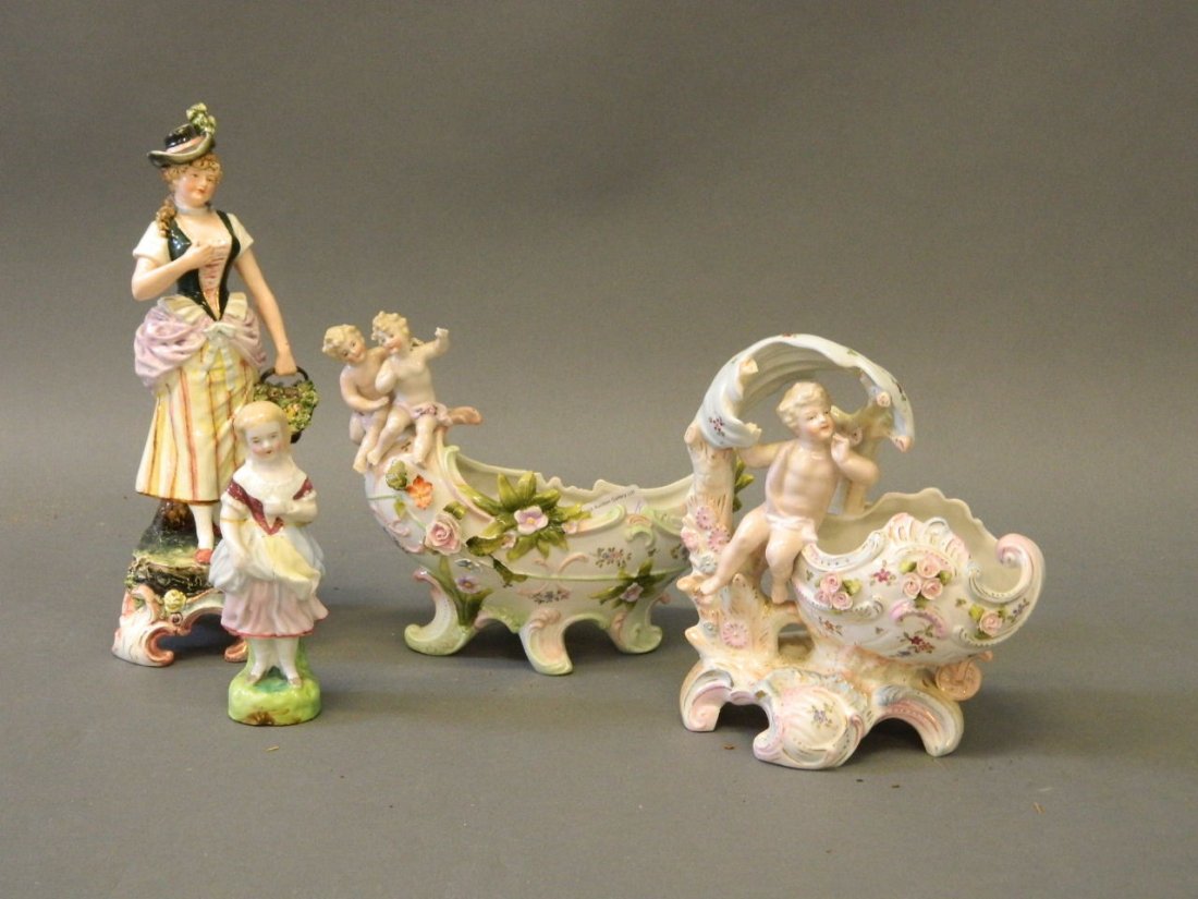 A Continental porcelain centrepiece with cherubs and (1 of 4)