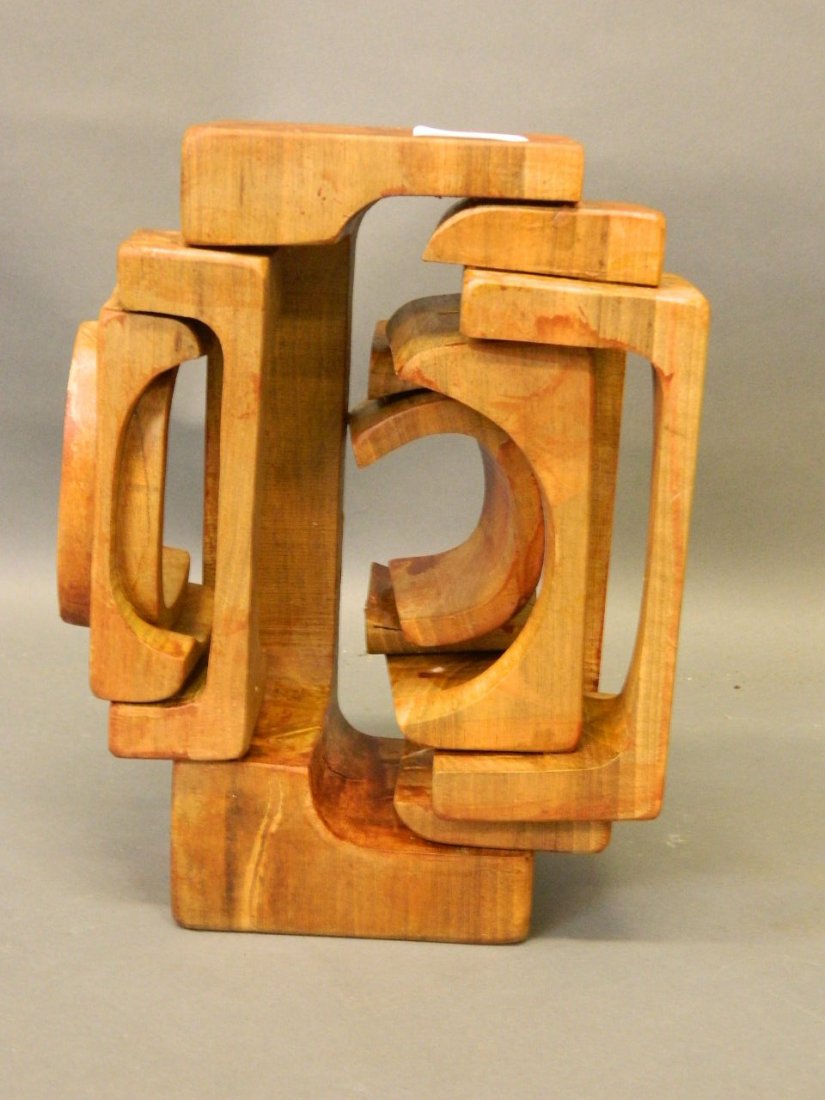A Modernist fretted stained wood sculpture, the base: A Modernist fretted stained wood sculpture, the base inscribed in pencil 'Brian Wilshire 1980', 11'' high