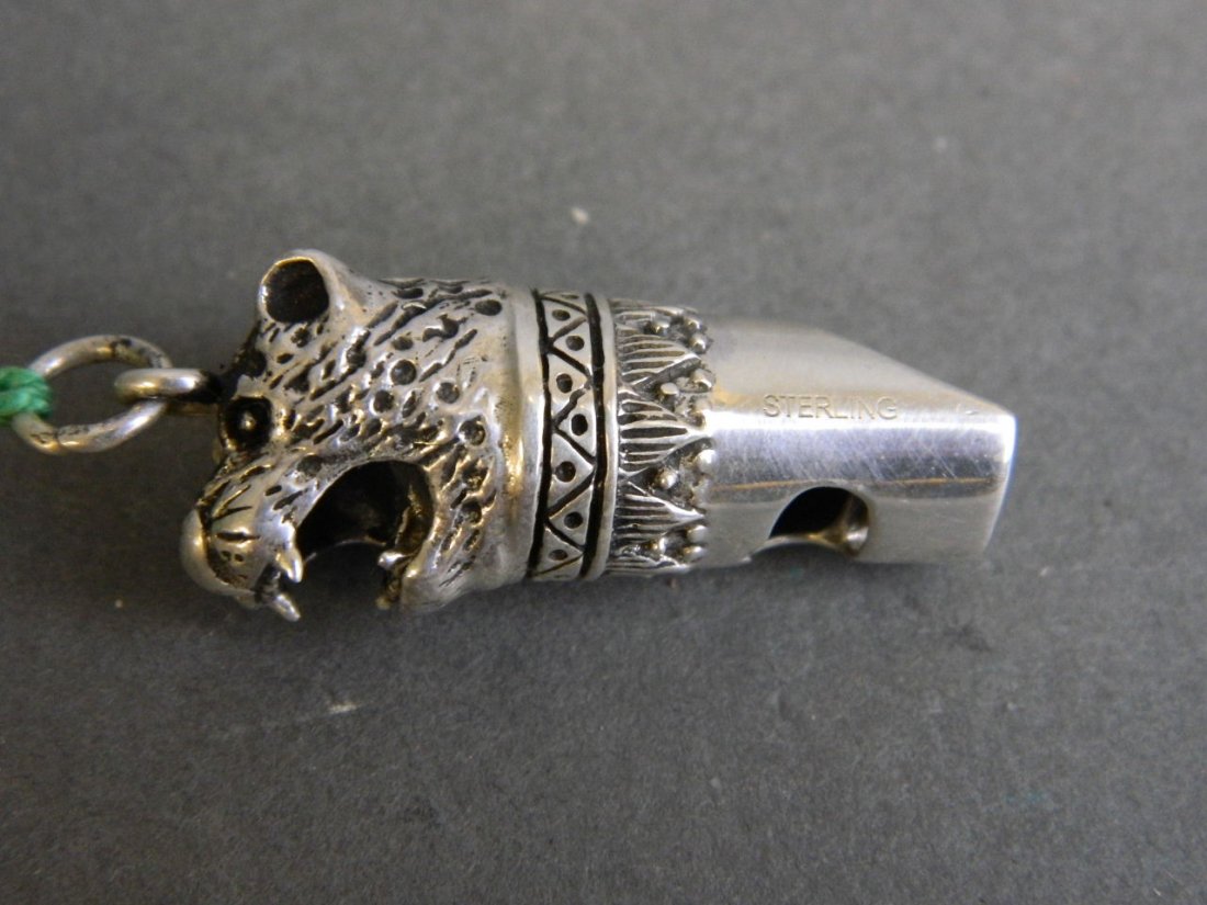 A small silver whistle in the form of a bear's head (1 of 1)