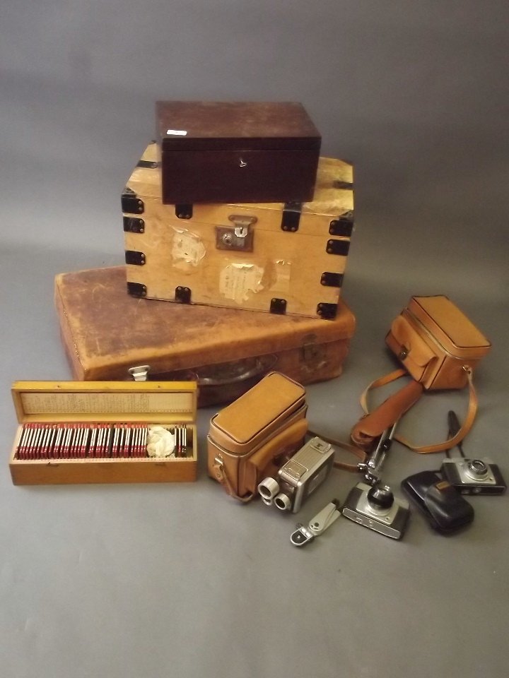 A leather suitcase, a deed box, a quantity of lantern (1 of 4)