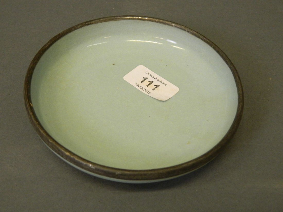 A Chinese blue glazed earthenware dish with metal rim, (1 of 3)