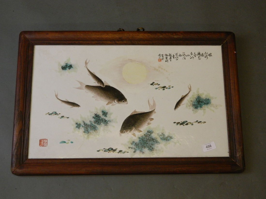 A Chinese porcelain plaque in a hardwood frame with: A Chinese porcelain plaque in a hardwood frame with enamel decoration of fish under a watery sun, with verses and seal mark, 25'' x 16''