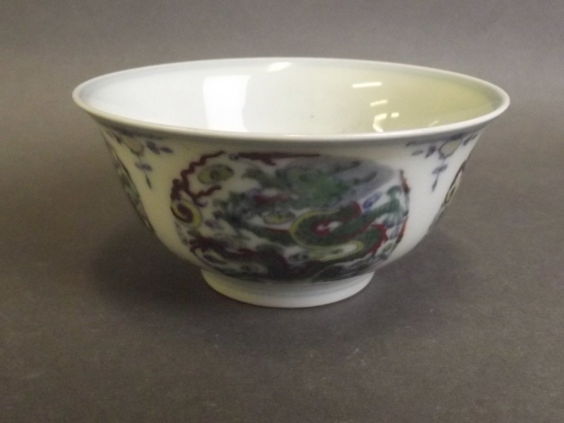 A Chinese Doucai enamel porcelain rice bowl with dragon: A Chinese Doucai enamel porcelain rice bowl with dragon and flaming pearl decoration, 4'' diameter