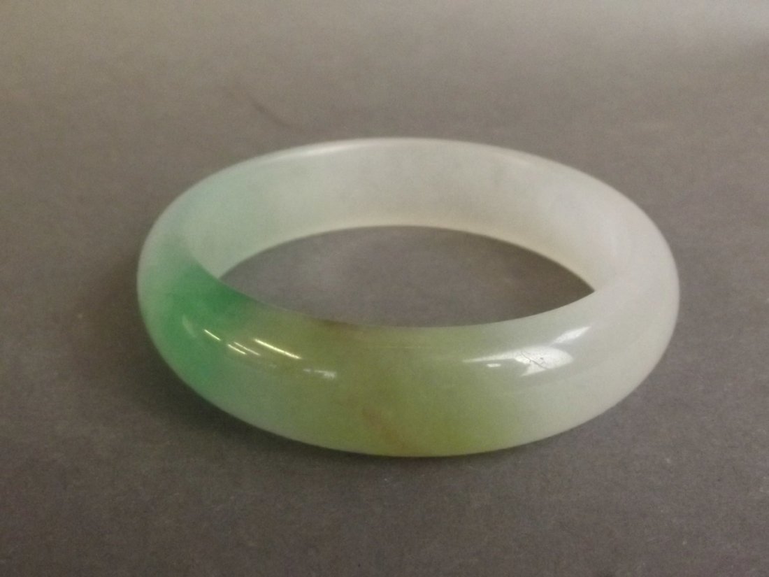 A Chinese bi-colour jade bangle, 3'' diameter (1 of 1)