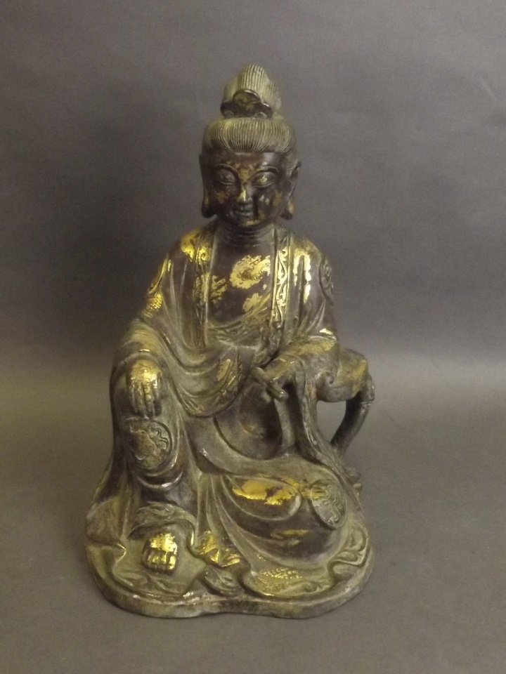 A large Chinese bronze figure of Quan Yin with gilt: A large Chinese bronze figure of Quan Yin with gilt splash decoration, impressed 6 character mark verso, 10«'' high