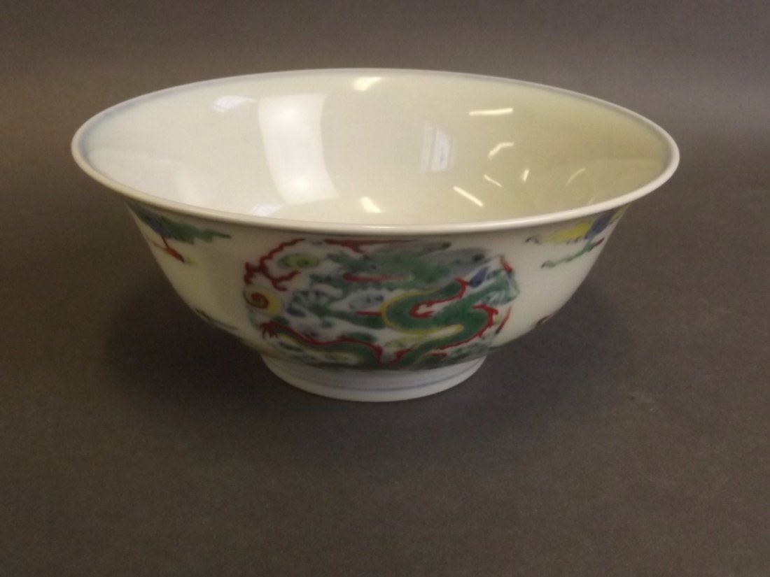 A good Chinese Doucai enamel porcelain rice bowl with: A good Chinese Doucai enamel porcelain rice bowl with painted decoration of a dragon chasing the flaming pearl, 6 character mark to base, 5«'' diameter