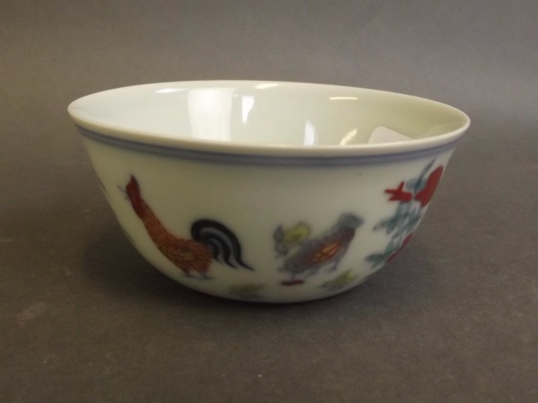 A fine Chinese Doucai enamel tea bowl decorated with (1 of 4)