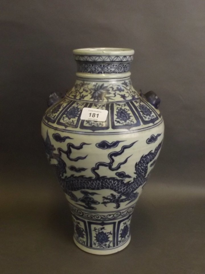 A C19th Chinese blue and white porcelain meiping vase: A C19th Chinese blue and white porcelain meiping vase with lion mask handles and painted dragon decoration, 14'' high