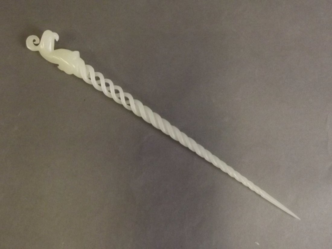 A Chinese carved and pierced white jade hairpin with (1 of 2)