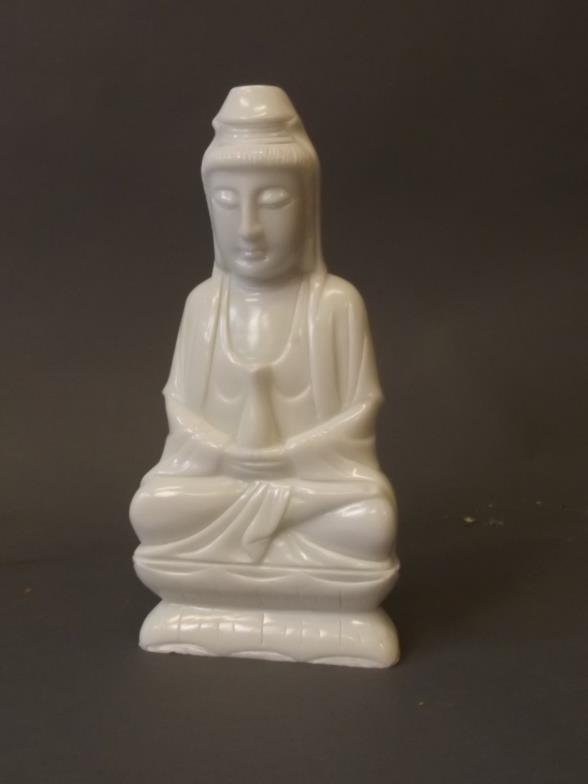 An opaline glass figure of Quan Yin, 11Â½" high: An opaline glass figure of Quan Yin, 11Â½" high