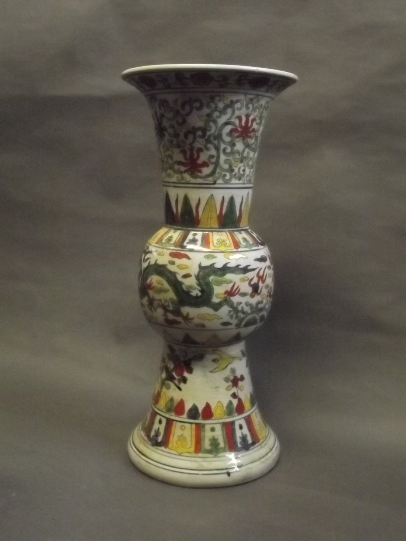 A Chinese porcelain vase with flared rim and dragon: A Chinese porcelain vase with flared rim and dragon decoration in the Doucai palette, 6 character mark to base, 18" high
