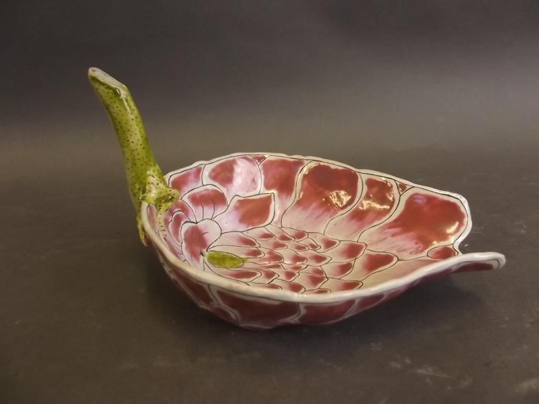 A Chinese porcelain pourer in the form of a lotus leaf: A Chinese porcelain pourer in the form of a lotus leaf with bright enamel decoration, inscription to stem, 6" long