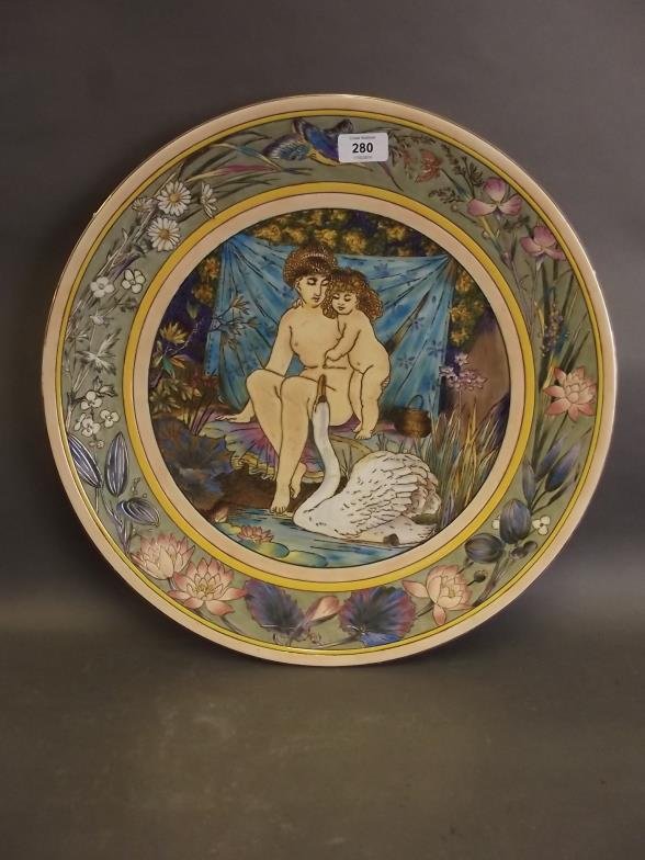 A large porcelain charger painted with nude figures and: A large porcelain charger painted with nude figures and a swan in the Italian style, 18" diameter
