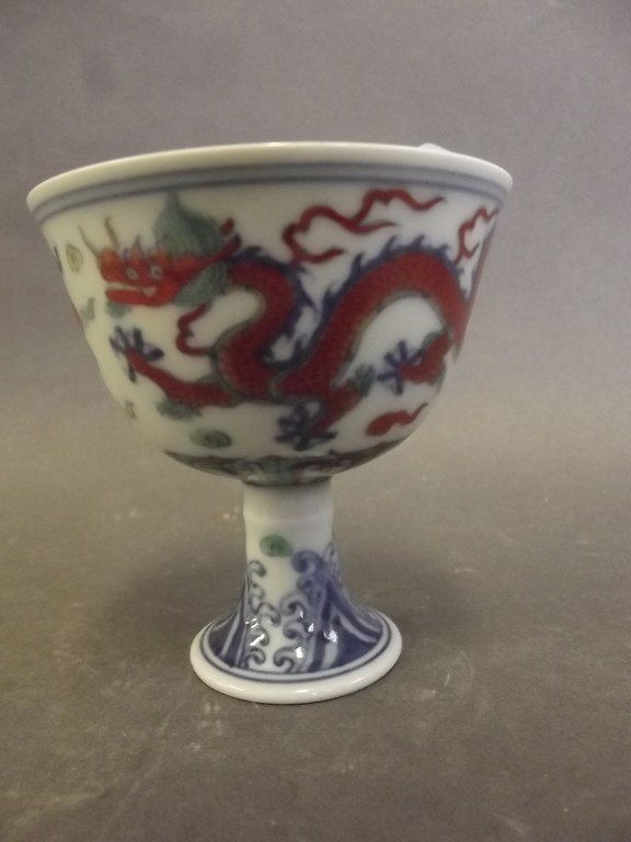 A Chinese Doucai porcelain stem cup decorated with (1 of 3)