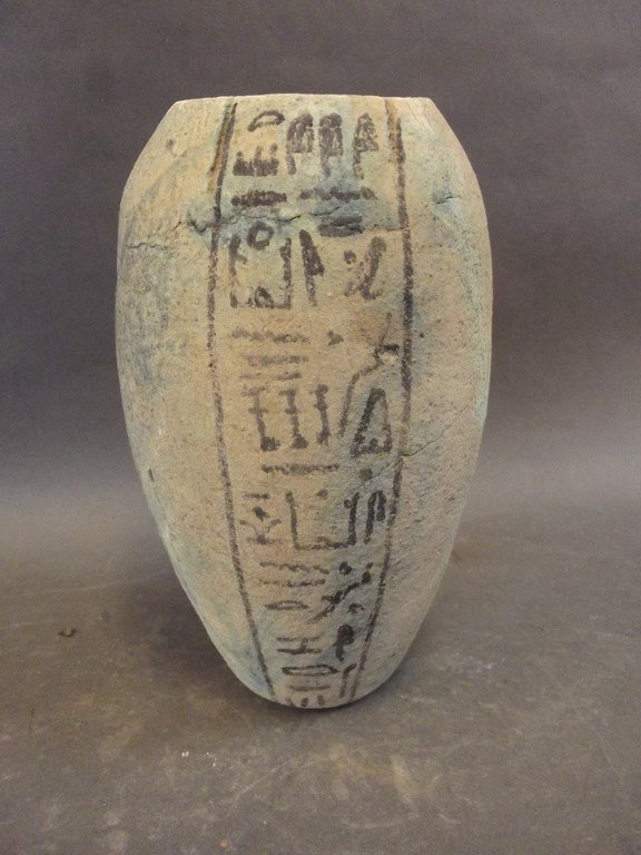 An Egyptian terracotta funerary vase decorated with (1 of 1)
