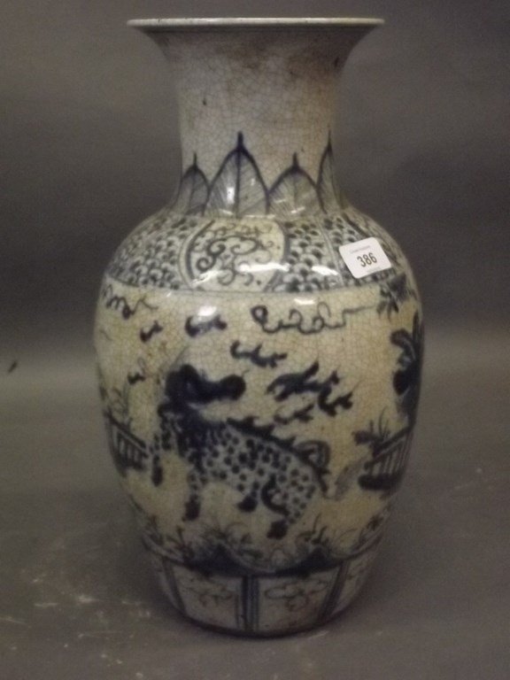 A Chinese crackle glazed earthenware vase with kylin (1 of 2)