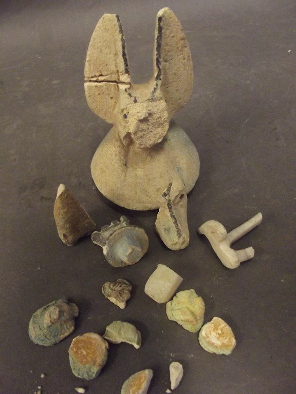 An antique Egyptian shabti of Anubis, for restoration,: An antique Egyptian shabti of Anubis, for restoration, and other early shards, 3Â½" high (AF)