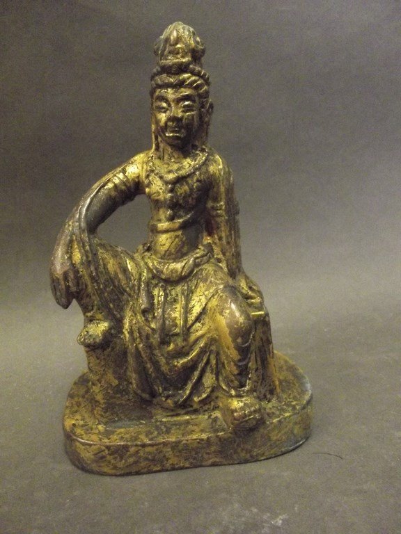 A Chinese gilt bronze figure of Quan Yin seated, 5": A Chinese gilt bronze figure of Quan Yin seated, 5" high