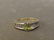 A 14ct gold peridot diamond ring with Chanel set