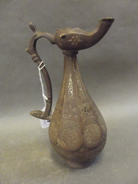 A Middle Eastern bronze ewer/lamp with inlaid copper (1 of 1)