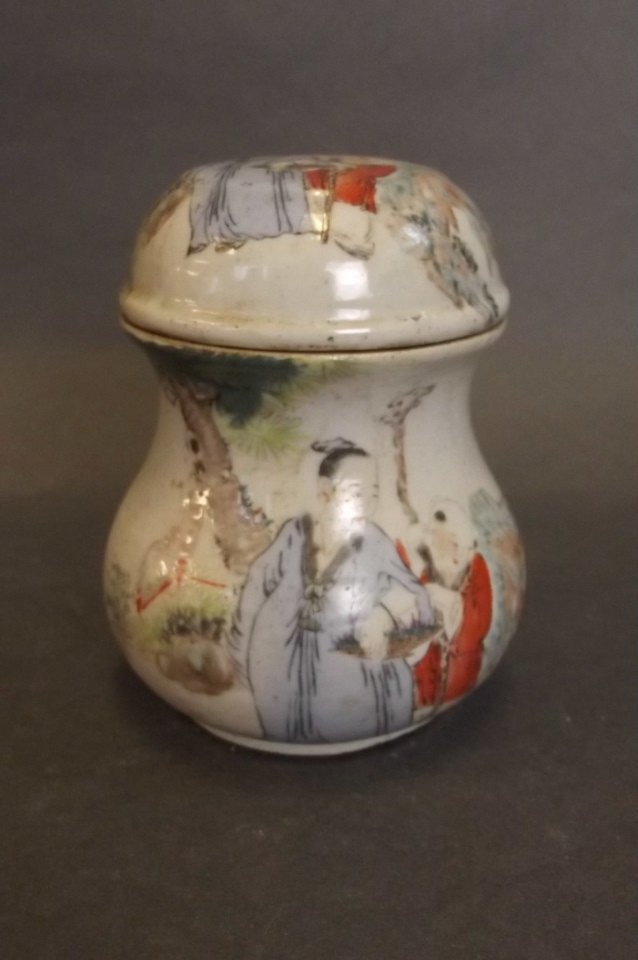 A small Chinese jar and cover with printed decoration: A small Chinese jar and cover with printed decoration of a sage and acolyte, seal mark to base, 4" high