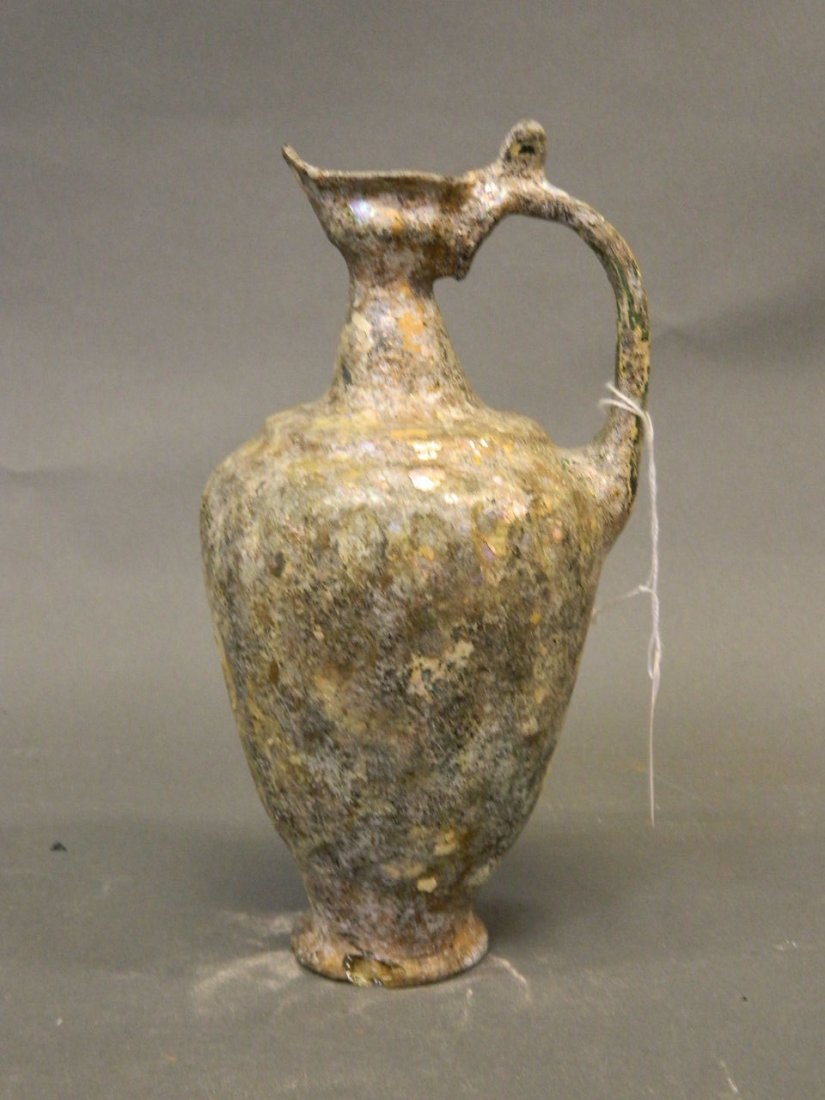 A Middle Eastern iridescent glass ewer, 8" high (1 of 1)