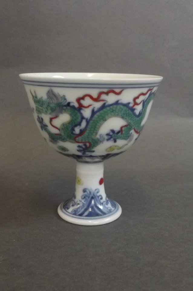 A fine Chinese Doucai enamel stem cup with twin dragon (1 of 3)
