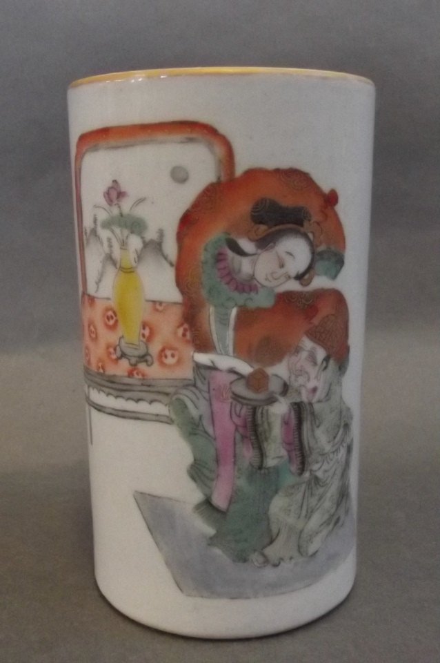 A Chinese porcelain brush pot decorated with figures in: A Chinese porcelain brush pot decorated with figures in bright enamels, red seal mark to base, 5" high