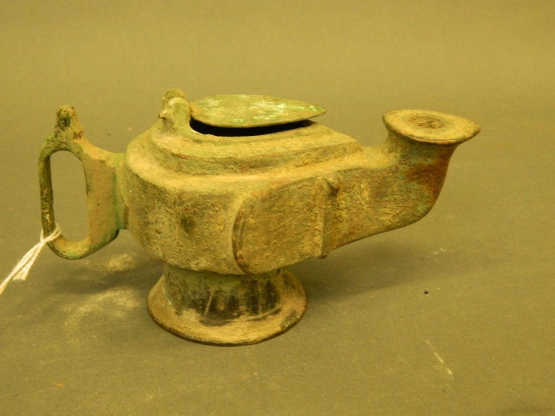 A Middle Eastern bronze oil lamp, 6" long (1 of 2)