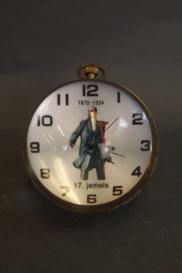 A brass bound bound ball desk clock with a dial (1 of 2)
