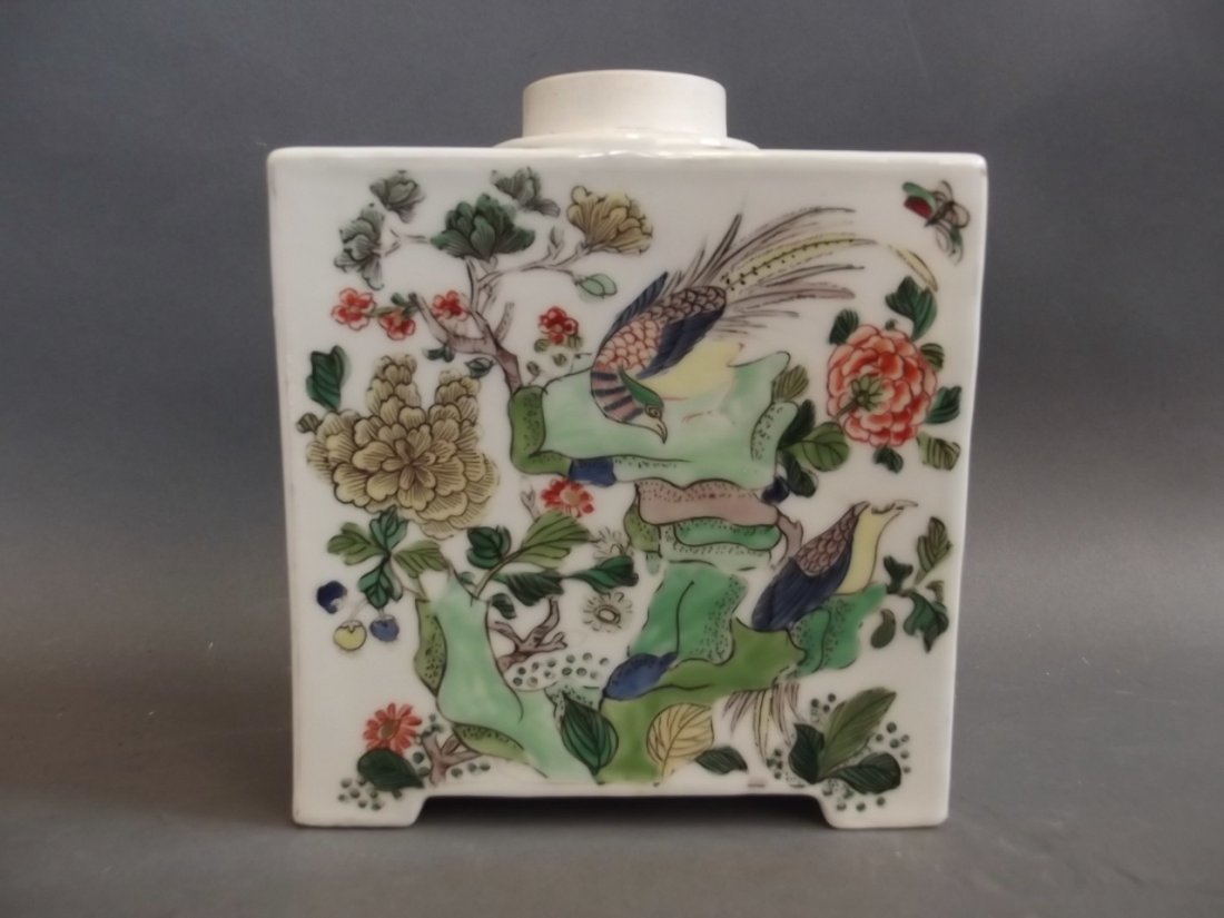 A Chinese porcelain rectangular canister decorated with: A Chinese porcelain rectangular canister decorated with birds, insects and blossom in the famille verte palette, 6" high