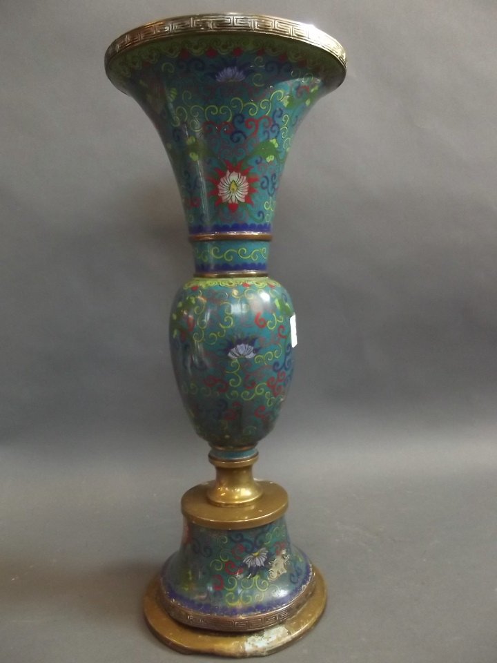 An Oriental cloisonn lamp base with floral decoration: An Oriental cloisonn lamp base with floral decoration on a blue ground, 15" high (AF)
