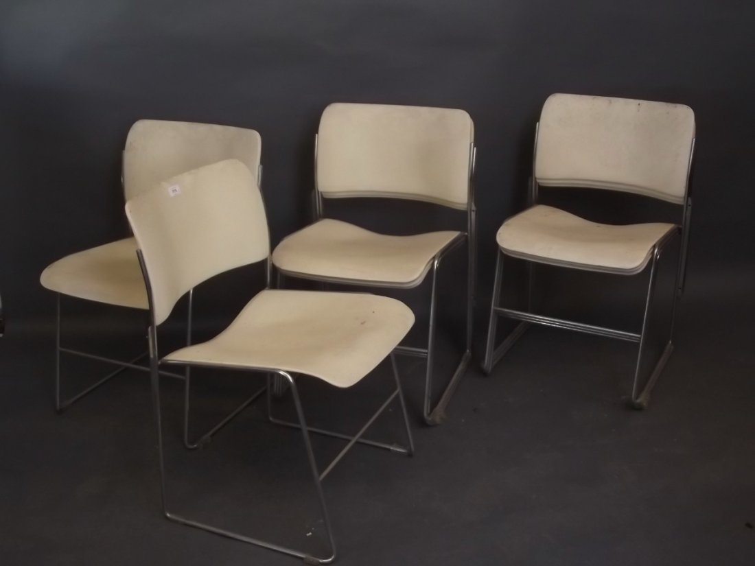 A set of eight chrome and painted metal stacking: A set of eight chrome and painted metal stacking chairs, labelled 'G.F. Business Furniture, the General Fireproofing Co., Ohio, USA', model no. 40/4, designed by David Rowland