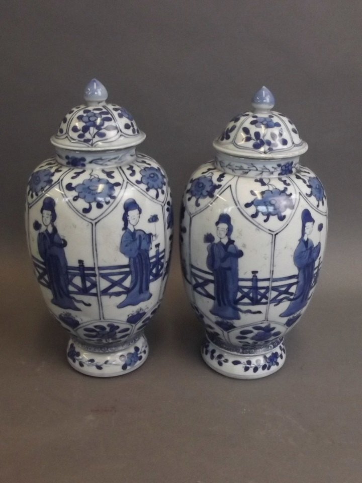 A pair of Chinese blue and white porcelain jars and: A pair of Chinese blue and white porcelain jars and covers with painted panels of Quan Yin, 9" high