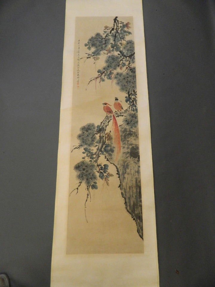 A Chinese watercolour scroll depicting exotic birds: A Chinese watercolour scroll depicting exotic birds perched on a branch, 18½" x 69"