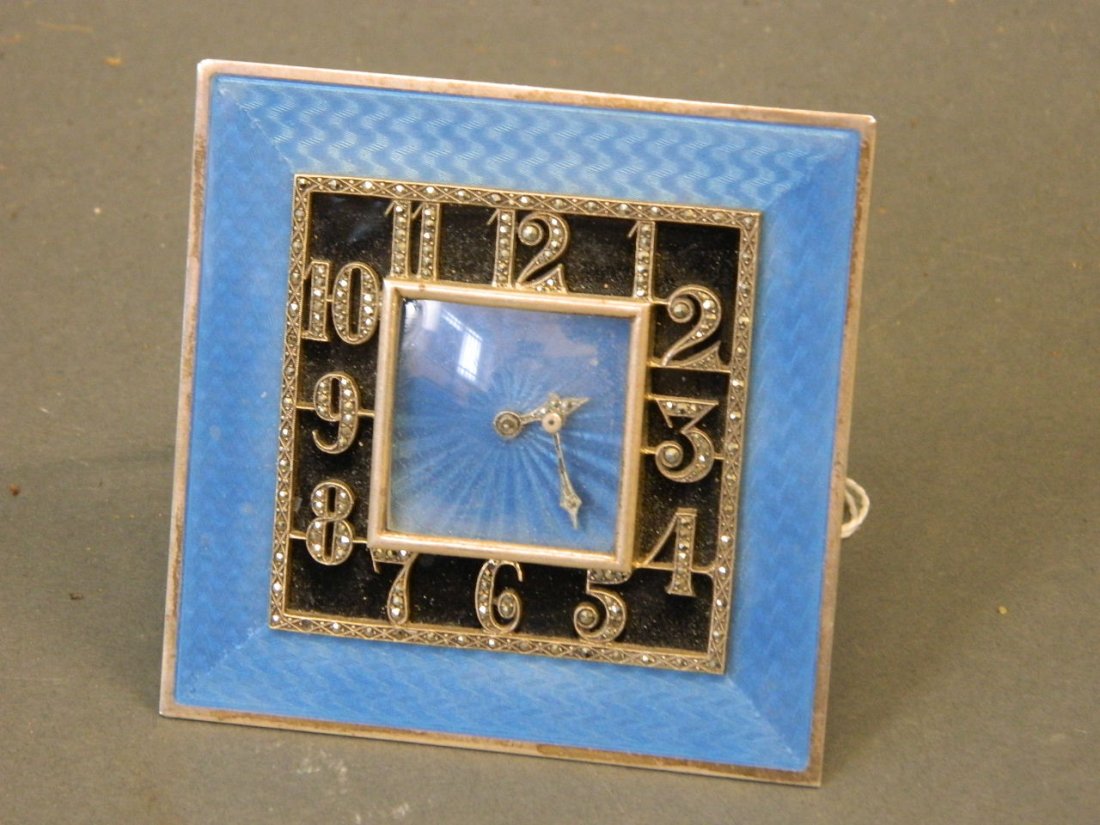 An Art Deco easel clock with blue enamel over an engine: An Art Deco easel clock with blue enamel over an engine turned border and Arabic numerals, inset with marcasite, 3½" square
