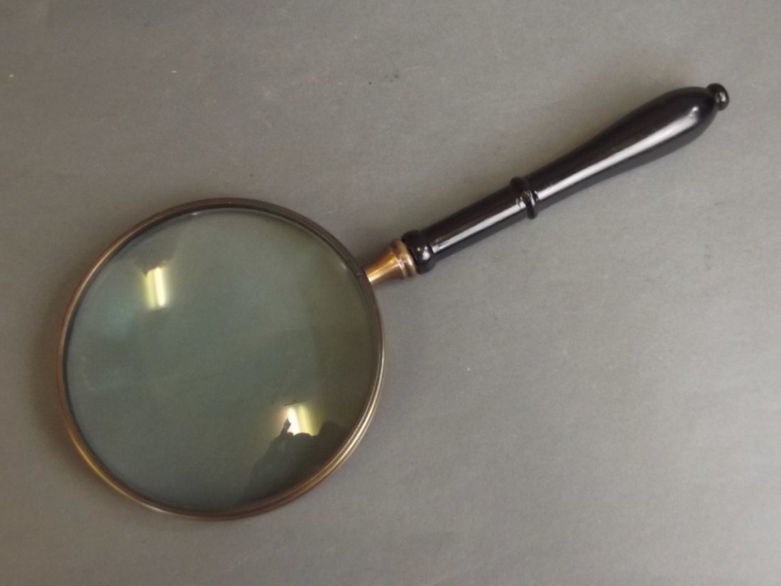 A large magnifying glass with bronzed frame and turned (1 of 1)
