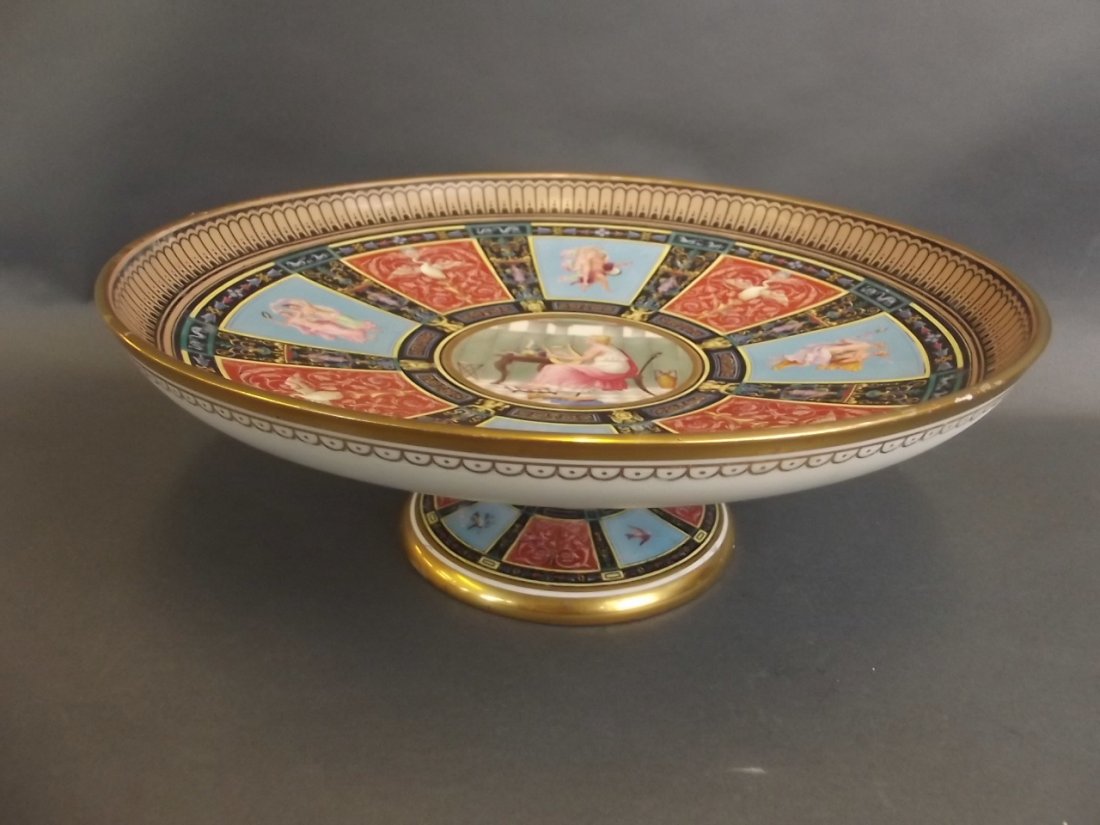 An Art Union of London Copeland porcelain pedestal: An Art Union of London Copeland porcelain pedestal tazza, hand painted with alternating panels of classical figures and a phoenix amongst scrolls, 13" x 5" (AF some restoration)