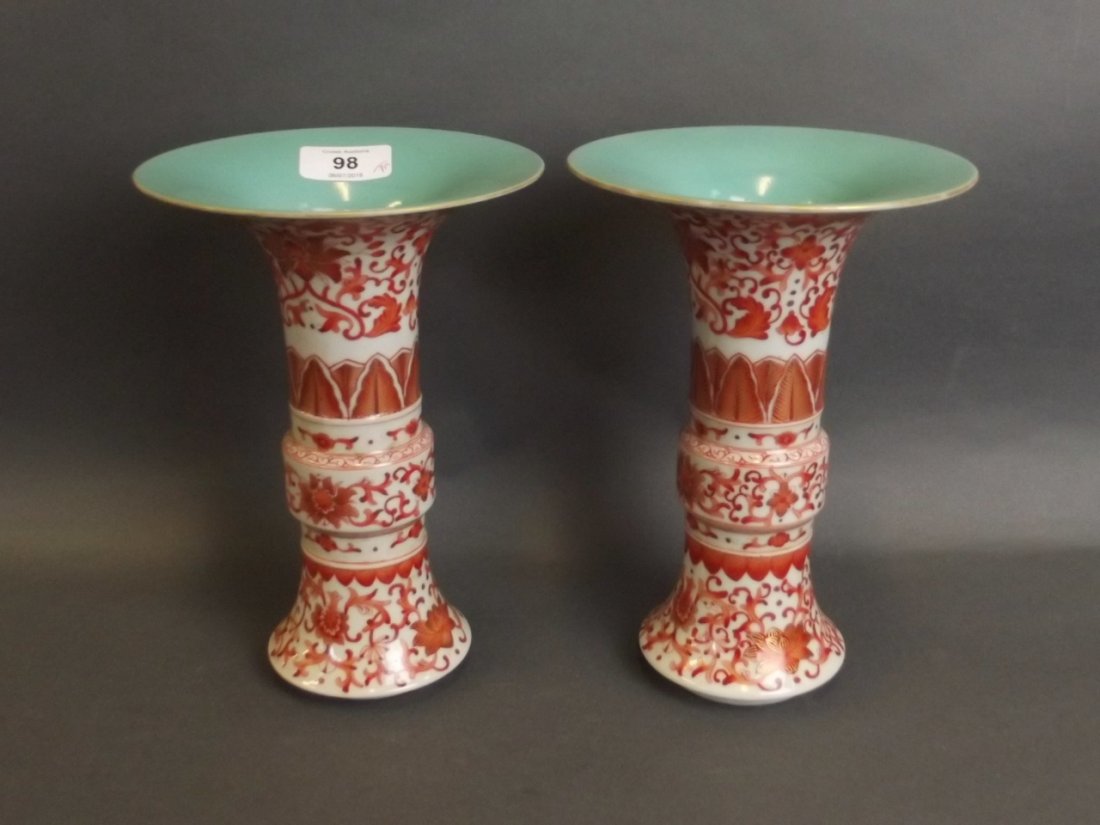 A pair of red and white porcelain Gu shaped vases with (1 of 3)