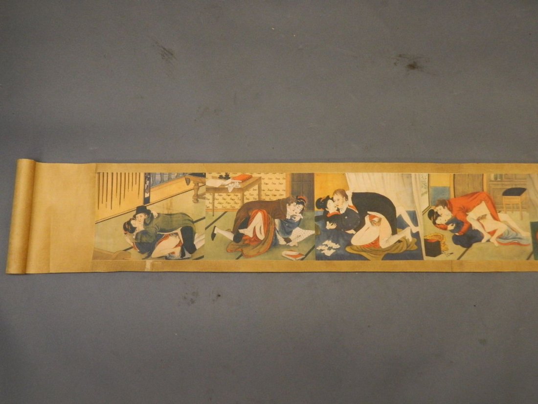 A Chinese scroll decorated with erotic scenes, 92" x 8": A Chinese scroll decorated with erotic scenes, 92" x 8"