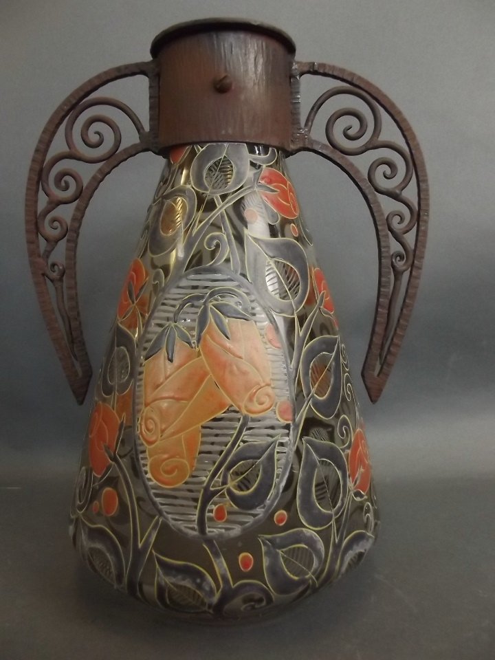 A 1930s French Art glass vase with stylised leaf: A 1930s French Art glass vase with stylised leaf decoration and cast iron handle, mount by Albert Mazoyer, signed to the body, 11" high