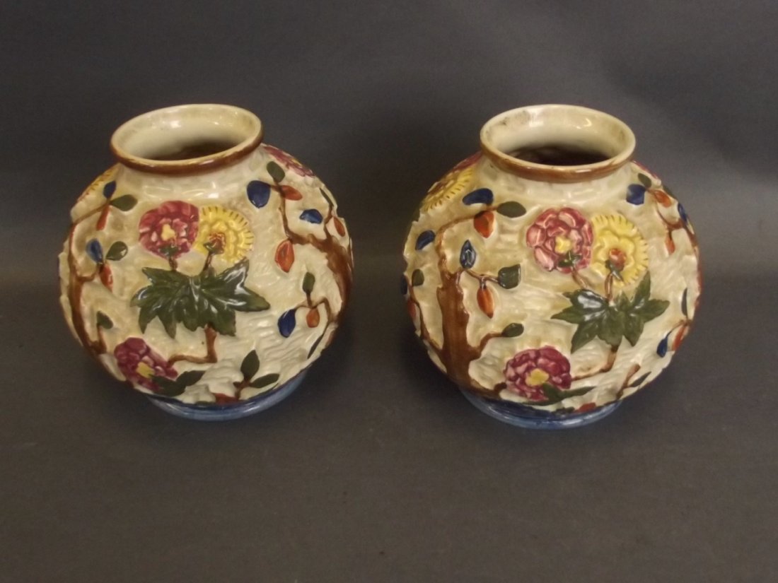 A pair of 1930s vases by H.J. Wood Burslem, with: A pair of 1930s vases by H.J. Wood Burslem, with moulded tree and blossom decoration, 5" high