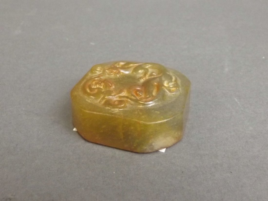 A Chinese marbled jade seal with carved dragon (1 of 3)