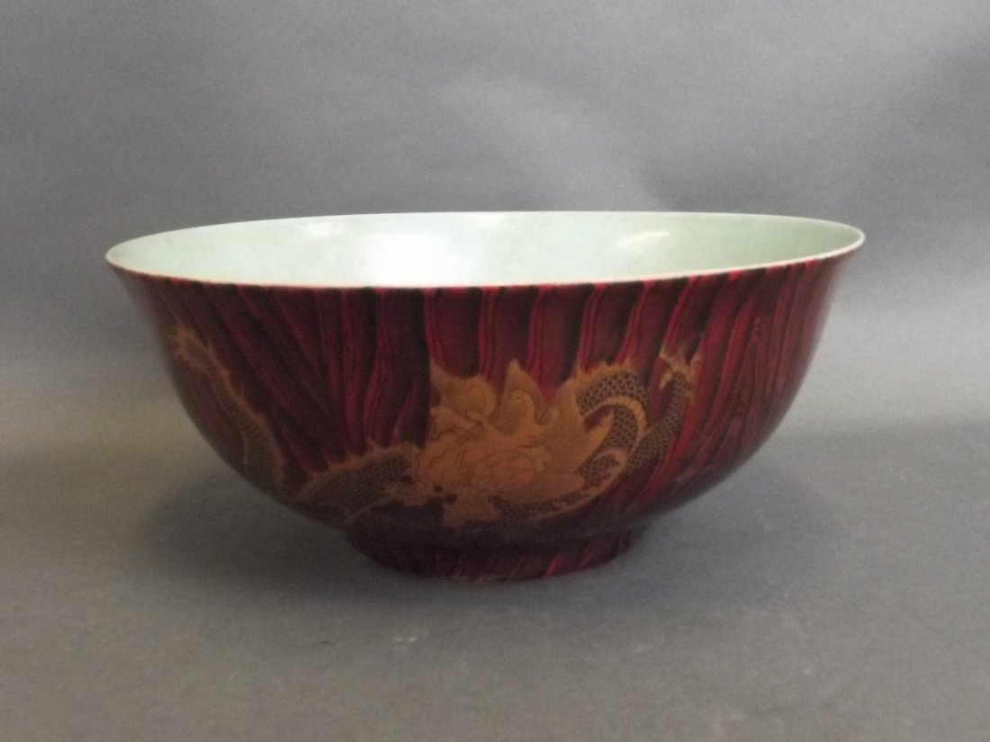 A Chinese porcelain bowl with applied dragon decoration (1 of 3)