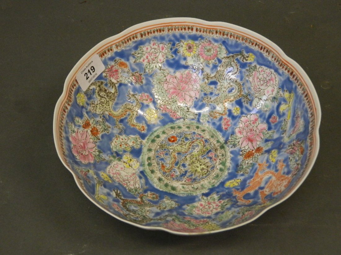 A Chinese eggshell porcelain bowl decorated with five: A Chinese eggshell porcelain bowl decorated with five dragons, seal mark to base, 10" diameter