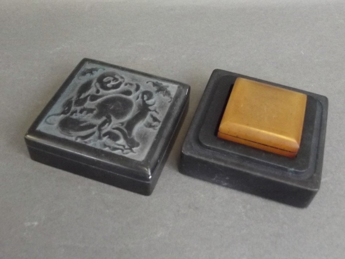 A Chinese amber soapstone seal in a green soapstone box (1 of 4)