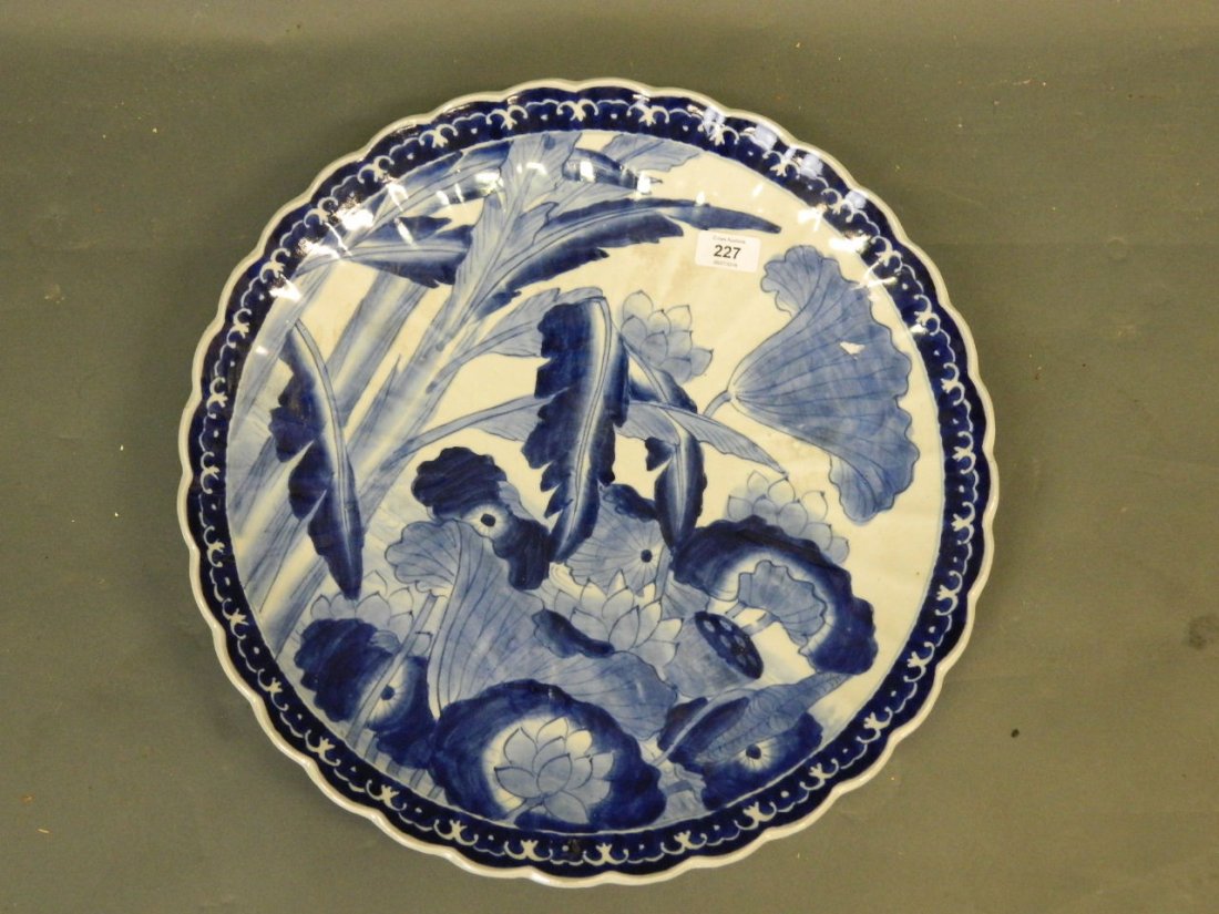 A large late C19th Oriental ribbed porcelain charger (1 of 2)