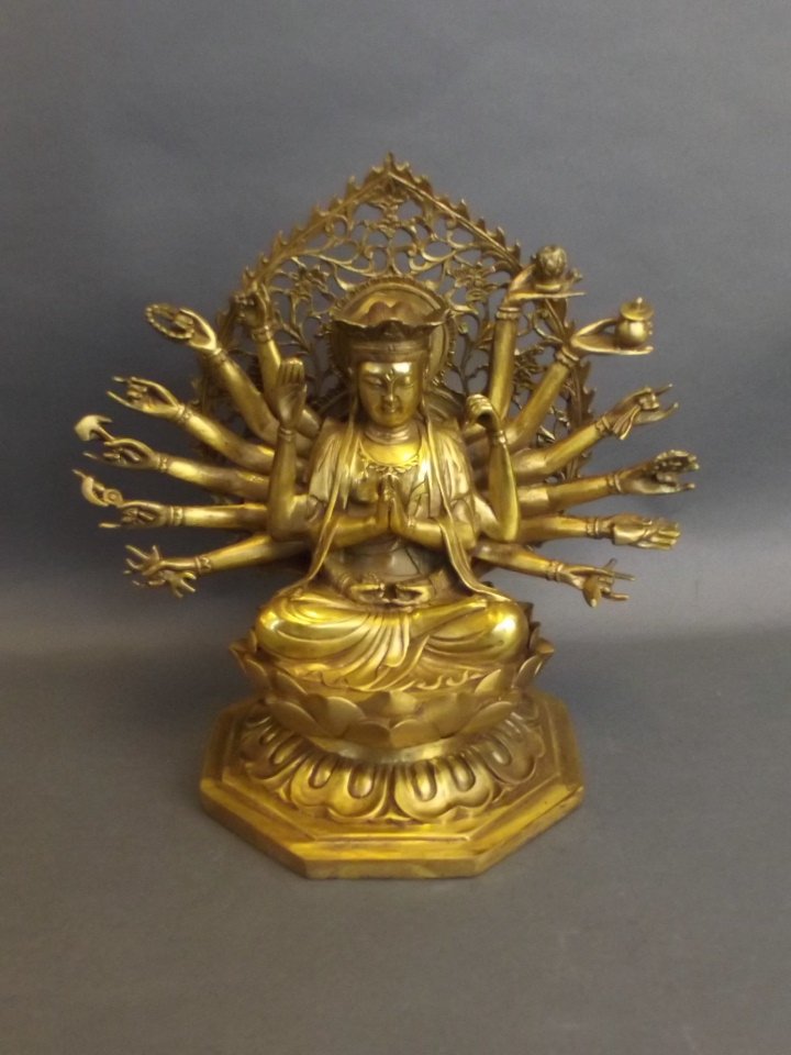 A Sino-Tibetan brass deity with many arms, 10" high (1 of 3)