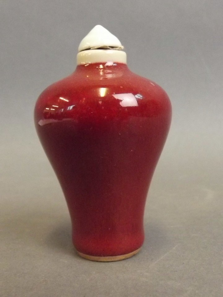 A Chinese sang de boeuf glazed porcelain snuff bottle, (1 of 2)